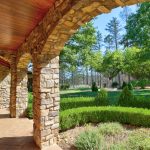 covered-patio-stone-arches-and-garden